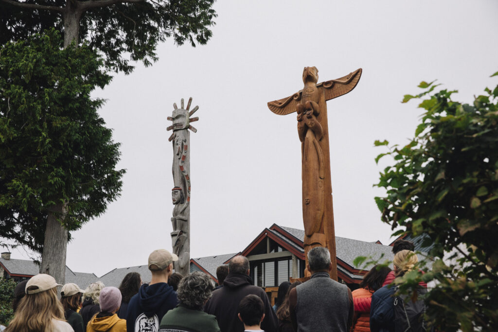 crowd overlooking the raised totem